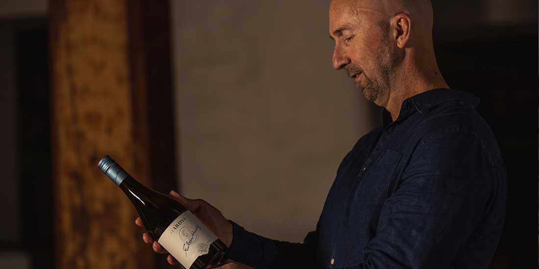Hardys winemaker Matt Caldersmith looks at a bottle of Eileen Hardy wine in a cellar