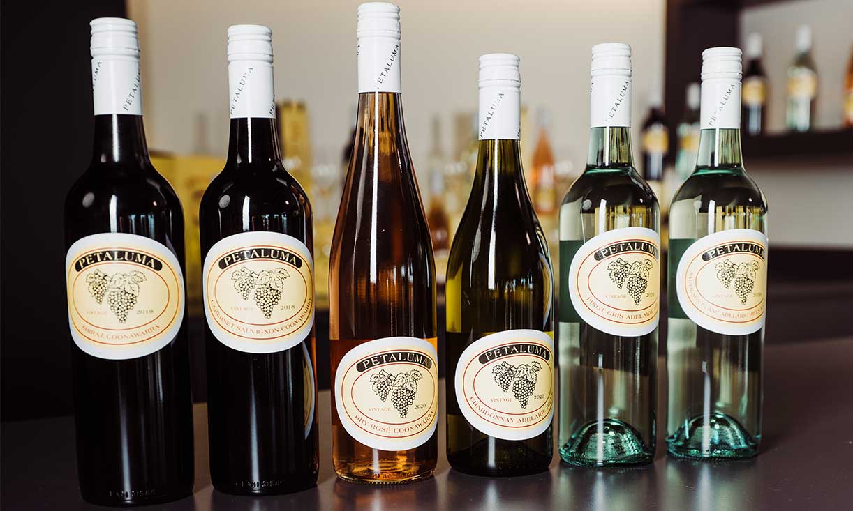 6 bottles of petaluma wines lined up