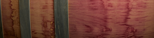 Close up side view of wine barrel stained with red wine