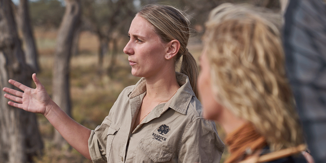 Banrock Station employee explaining something to people