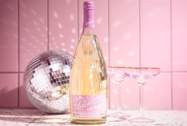 echo falls bottle in front of disco ball with champagne glasses
